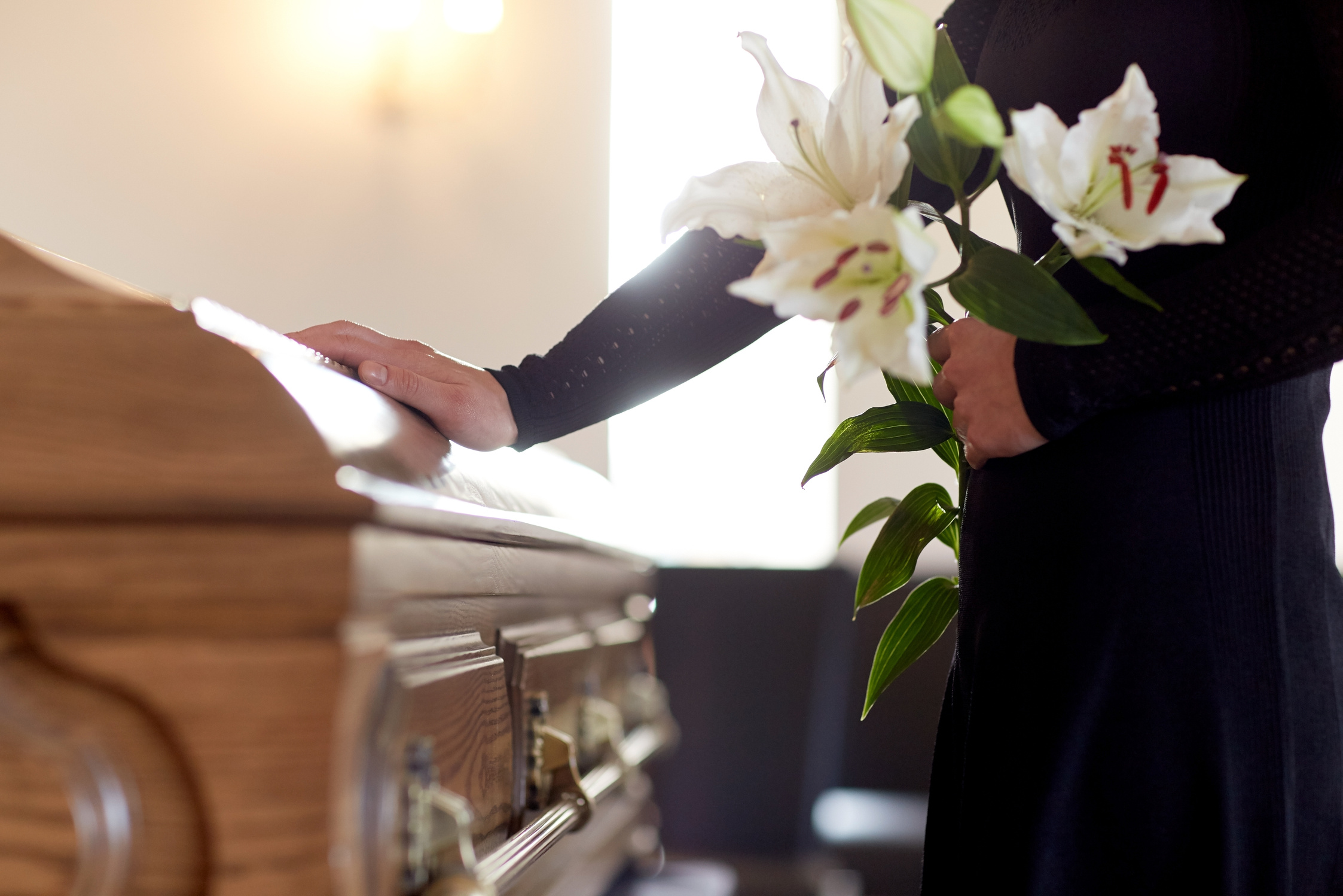 Woman with Lily Flowers and Coffin