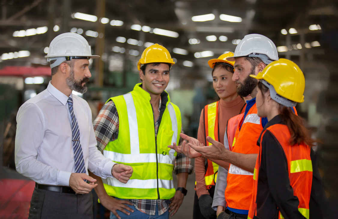 Group of Factory Workers in a Meeting 